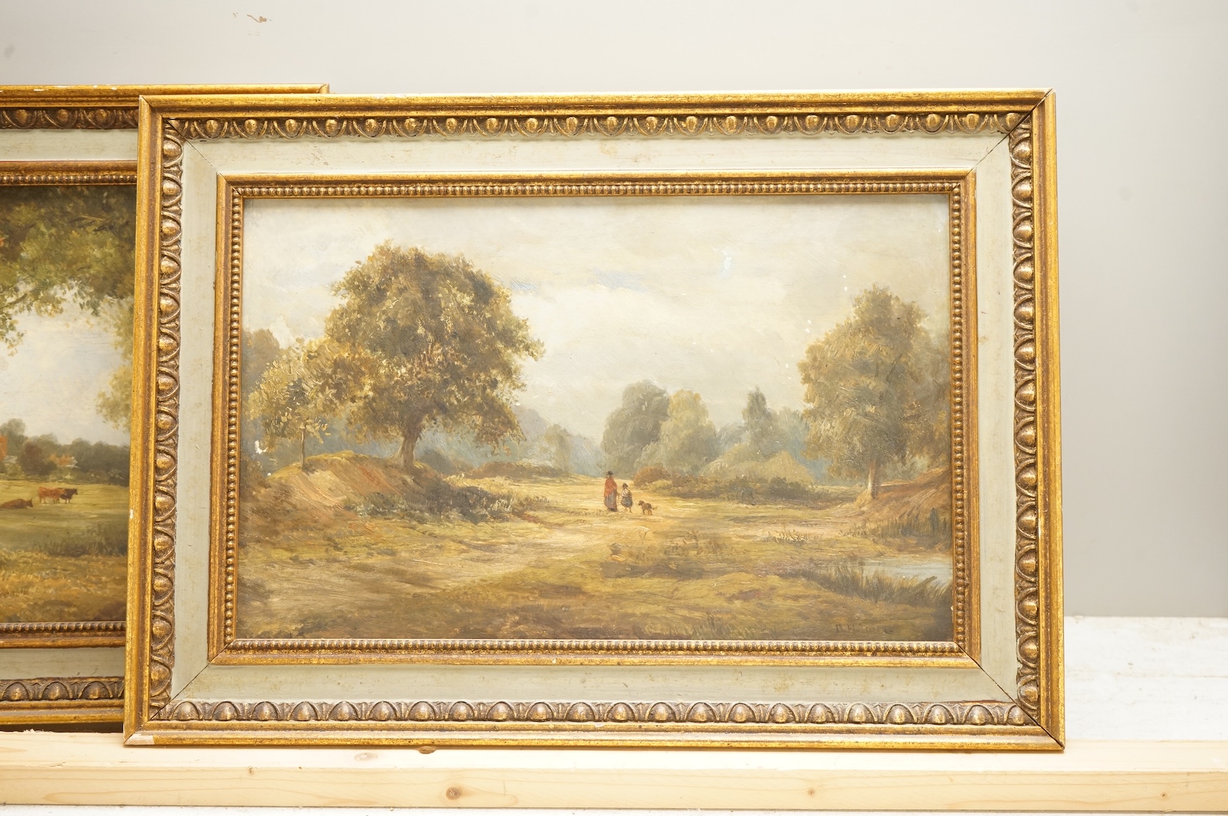 B. Holmes, Children in a meadow and riverscape, one signed, pair of oils on board, 19 x 29cm